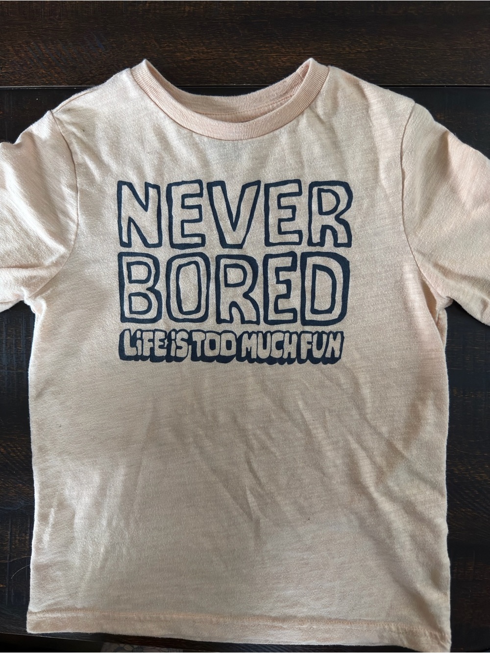 Garanimals Pale Orange Tee with Navy "Never Bored" Graphic